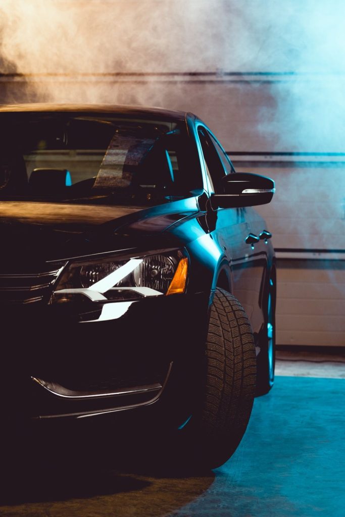Black shiny luxury car in garage with smoke 2026 03 12 23 55 15 utc.jpg